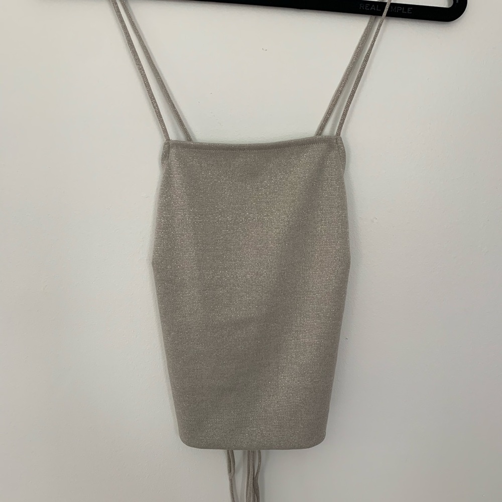 Silver tank with open back